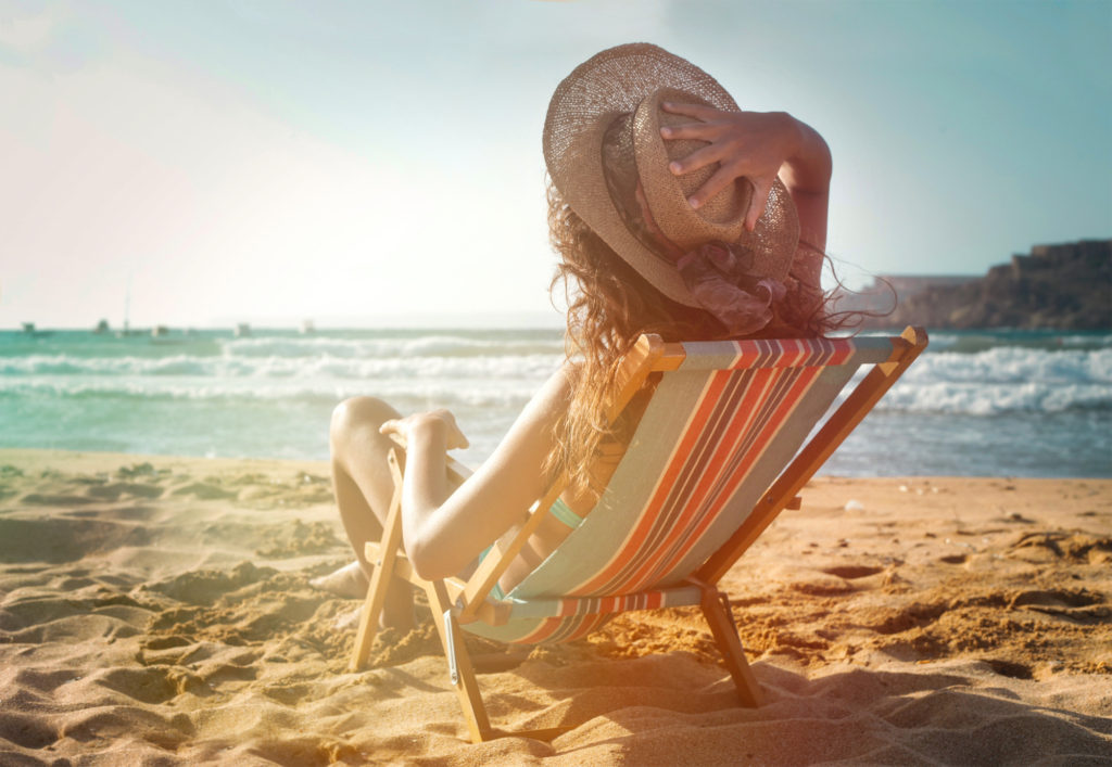 Woman Sunbathing on a Beach